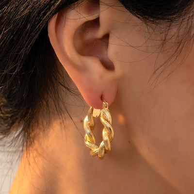 Punk Gold Color Twist Round Piercing Hoop Earrings Female Luxury CZ Crystal Geometric Ear Buckle Huggie Earrings Women Jewelry