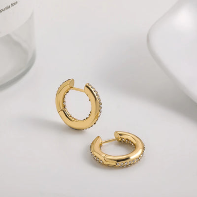 Punk Gold Color Twist Round Piercing Hoop Earrings Female Luxury CZ Crystal Geometric Ear Buckle Huggie Earrings Women Jewelry